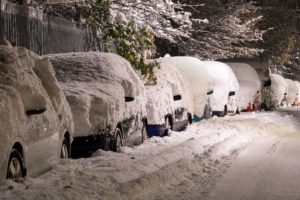 Image of cars covered in snow. Winter weather blog post