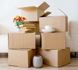 Image of house being packed up to move. Conveyancing Blog Post
