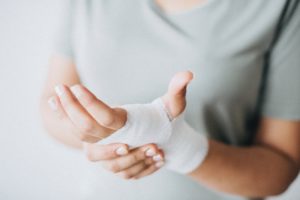 Image of bandaged hand Timms Blog post