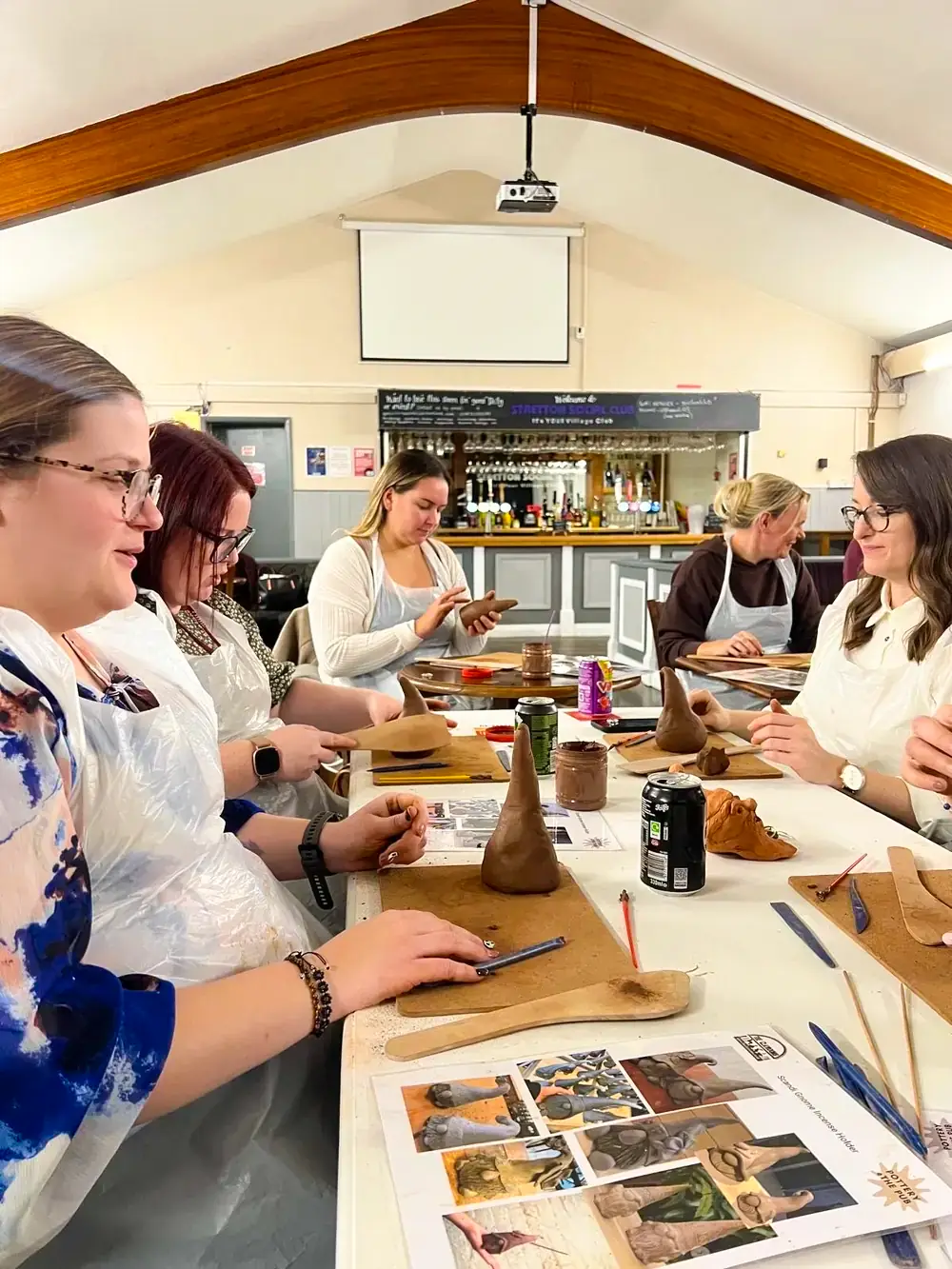 Making clay gnomes around a table